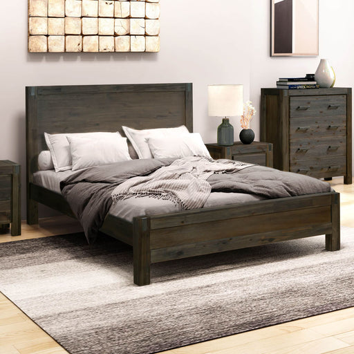The Acacia King Wooden Bed Frame in an indoor bedroom settings complemented with other chocolate wooden furniture