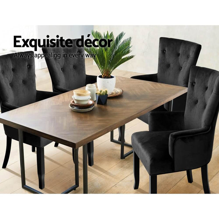 4 of the Artiss French Provincial Dining Chairs in Velvet Black around a Rectangular Dining Table in an Indoor Setting