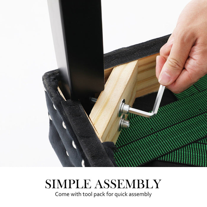 A human hand showcasing the simple assembly of one of the legs on the La Bella Velvet Black French Provincial Dining Chair which comes with a tool pack