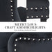 The silver studding embellished by hand being showcased on the black velvet chair structure