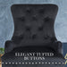 Front view of The La Bella Velvet Black French Provincial Dining Chair, showcasing its elegant tufted buttons, with a cloudy blue background.