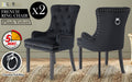 Front and back view of the La Bella Velvet Black French Provincial Dining Chair set in and indoor setting resting on a carpet on top of a timber floor, in front of a grey wall.