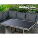 The Outdoor Dining Sofa Table Chair Lounge Set in Wicker Grey Focusing on its Matching Table with a Wicker Finish