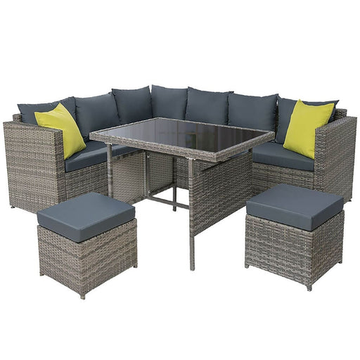 The Outdoor Dining Sofa Table Chair Lounge Set in Wicker Grey with a Plain Background