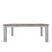 Side view of The Plumeria Solid Acacia Wood Dining Table with a White Background